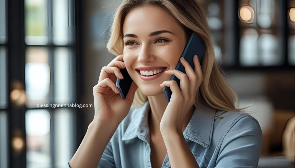 A person on a phone smiling and politely declining an offer