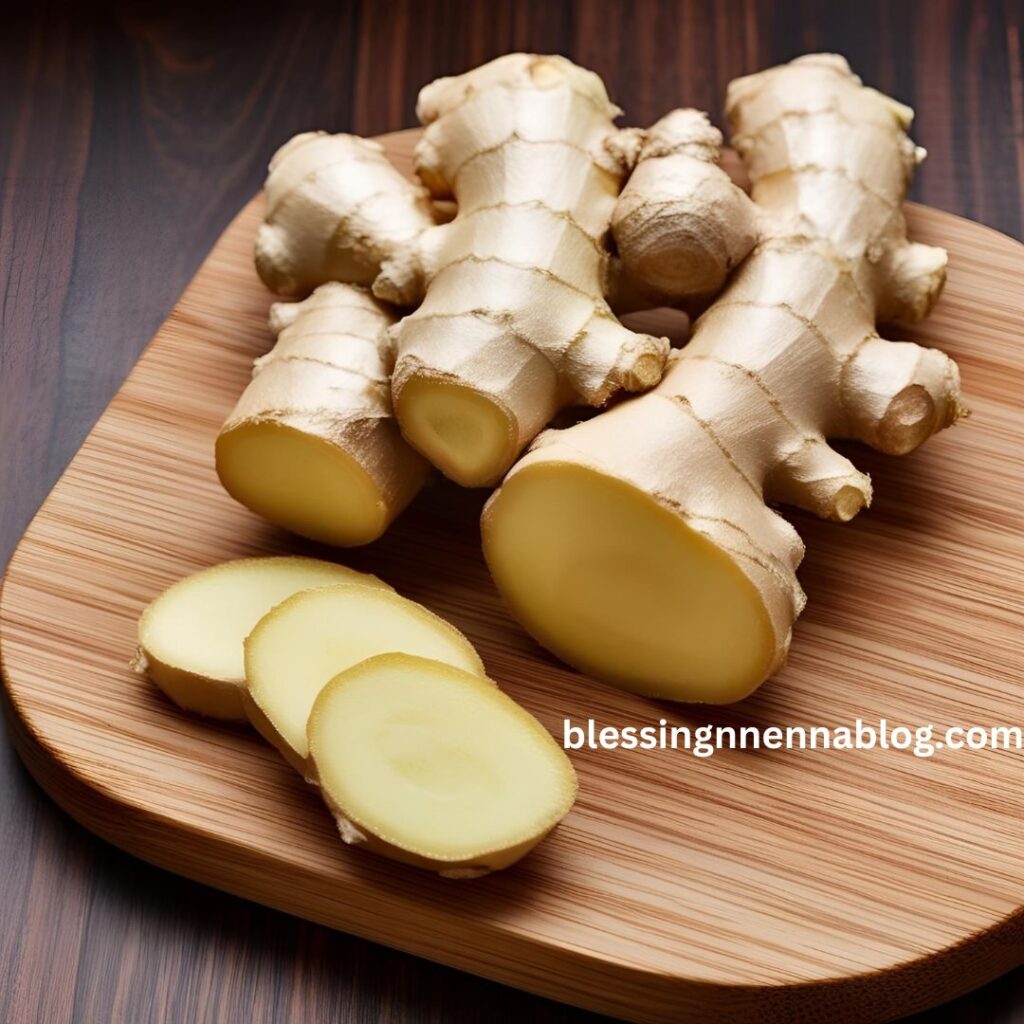 Fresh ginger root on a wooden board with slices, commonly used in Nigerian dishes and herbal remedies.